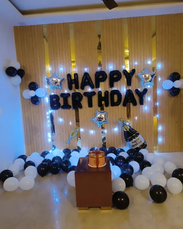 birthday decoration with black and white balloons